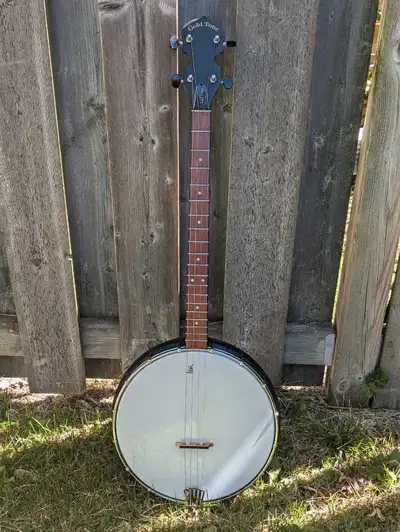Tenor Banjo, Gold Tone, excellent condition, scale length 22.5,", overall length 34". $250.00.