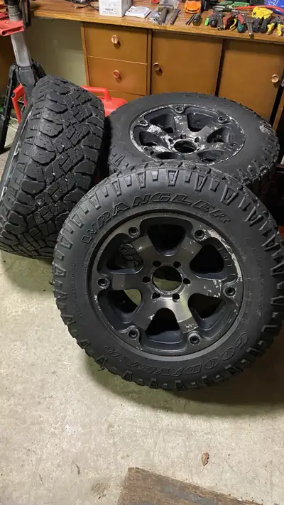 I am selling a set of used 275/65R18 Goodyear Duratrac tires mounted on Fuel rims with a 6x139.7 bol...