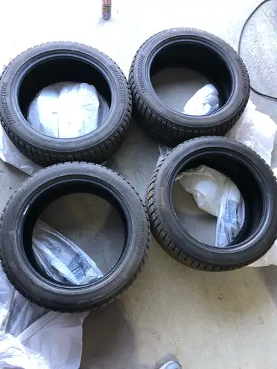 Set of four Bridgestone Blizzak WS90 winter tires, size 235/45/R17. Low mileage, excellent condition...