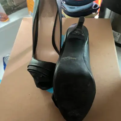 Vintage black matte finish 2 inch heels open toed with flower wrapped onto the toe area, non smoking...