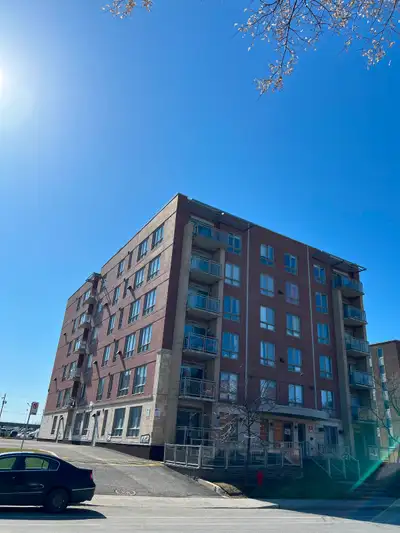 Bright and inviting 2-bedroom corner condo in a concrete building on Ward Street in Ville-Saint-Laur...