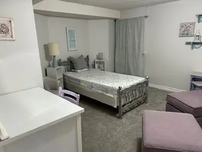 Furnished basement bedroom , new carpet and fresh paint, for a single person in a large shared basem...