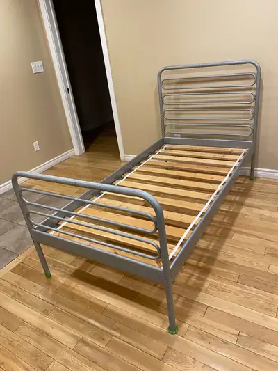 Selling a twin size IKEA metal bed frame in good condition. This is a solid and sturdy frame that in...