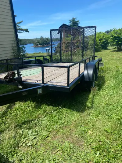 6x10 utility trailer. Tantum axle. Solid welded construction 2x3” hollow steel section frame. Wooden...