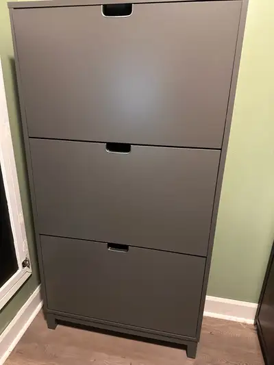 Selling a grey shoe storage unit. Keeps shoes discretely hidden, reduces dust. Dimensions in the thi...