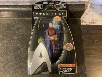 2009. Includes bonus gold star fleet emblem figure stand, phaser, communicator, data tablet, utility...