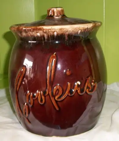 Lot of vintage Hull dishes. Lot includes 9 cups and a cookie jar. All in good condition except cooki...