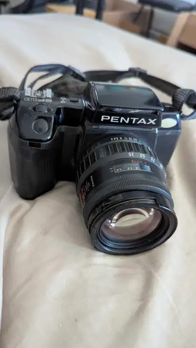 I'm selling a Pentax SF10 35mm SLR film camera with a Pentax 35-70mm lens. The camera is used and I'...