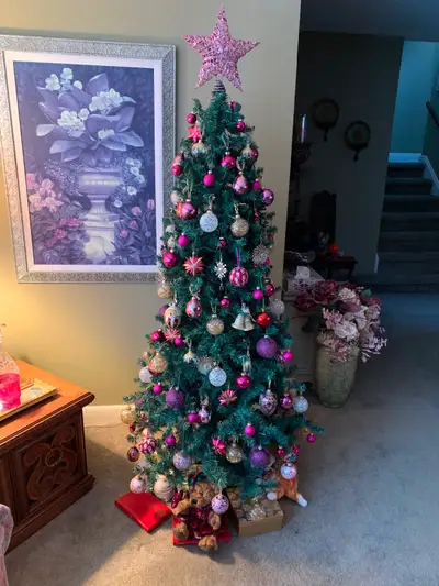 Christmas Tree with lights and decorations in boxes.