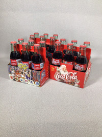 Vintage 6 pack Coca Cola bottles in carrier from 1999