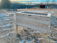 Raised wooden brooder with removable tray