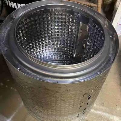 For sale a washer drum to repurpose as a fire pit. . Dimensions are 22”wide by 21” depth for extra l...
