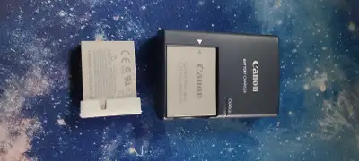2 canon battery packs nb-5l plus charger, View more