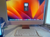 Pink 24-inch iMac with wireless Magic Keyboard and magic mouse