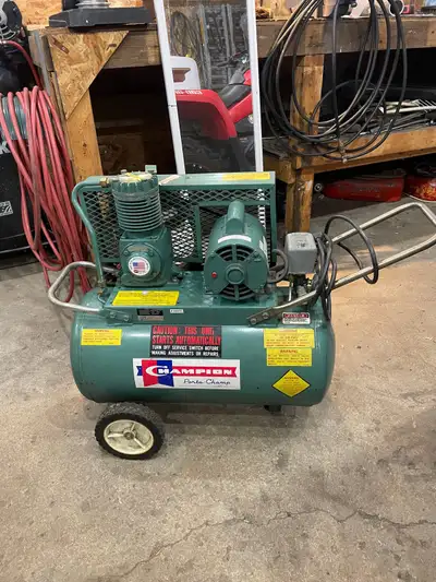 Perfectly functioning air compressor. Not sure of tank specs but the motor is 3/4 hp