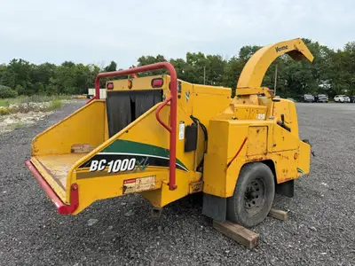 Commercial-grade Vermeer BC1000XL wood chipper - 85-hp Cummins B3.3 four-cylinder turbo diesel engin...