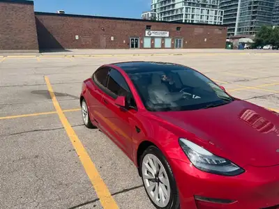 Tesla Model 3 2021 Red RWD no accidents. Winter and summer tires included in good condition plus rim...