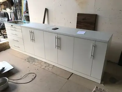 Upgrade your workspace with this premium white counter cabinet – the perfect blend of style, functio...