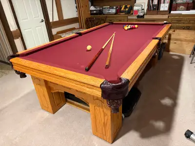 Full size pool table. Leather pockets. Pool cue rack. One set of standard balls and one set of small...
