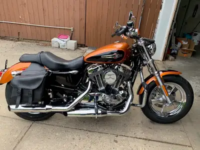 Mint condition 1200 Harley Davidson Sportster XLC. Comes with clip on windshield, saddle bags ,Vance...