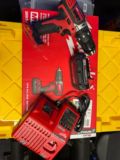 Milwaukee -hammer drill with charger and battery , View more