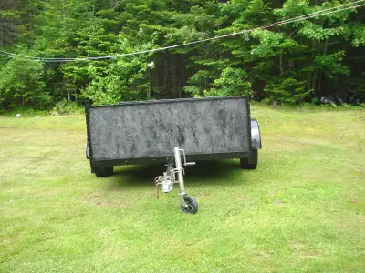 Utility trailer 5x10 wide 8ft long 14"tires tagged ,tilts ..$1200 for more info call 505 476-1098