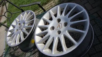 I have a pair of 15" Alloy rims from an 2000s Acura EL Bolt/ Lug pattern is 4X100 One is in good sha...