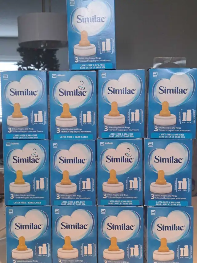 13 boxes of Similac Ready to Feed Infant nipple and ring.