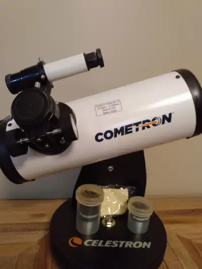 Cometron Small Telescope with attachments new not used. Perfect for star gazing and looking at the p...