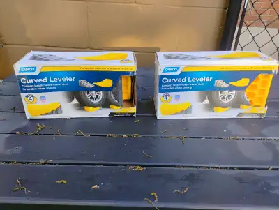 Curved leveling blocks for trailer or RV wheels no longer used. Helps avoid rolling off the bed and...