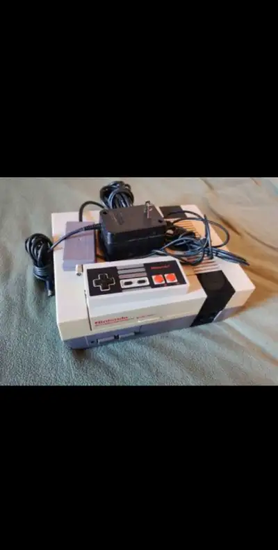 Consolle du premier nintendo avec toute les fil . Et 1 original, View more