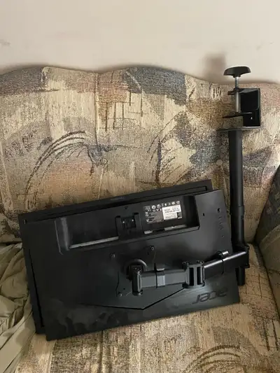 2 computer monitors and the dual monitor bracket, View more