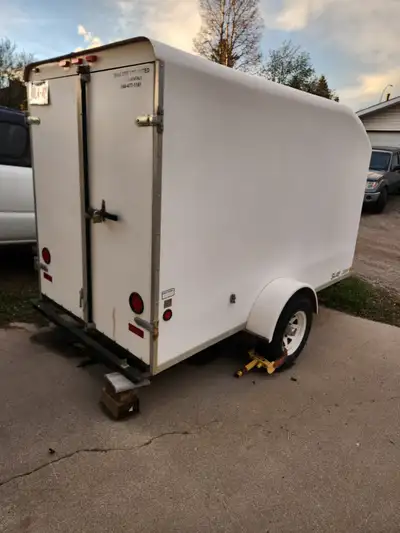 Trailers Unlimited 5 x 10 fiberglass utility trailer. Fully rigged for transporting a single motorcy...