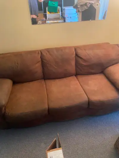Tan in color good starter couch