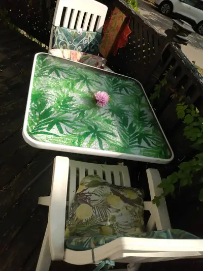 2 white folding patio chairs/ glass patio table, View more