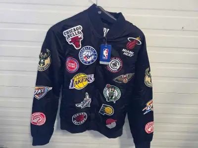 This stylish men's NBA bomber jacket, size medium, features patches from various NBA teams. It's in...