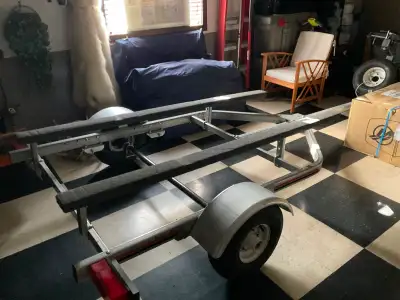 Multi sport 14’ galvanized steel trailer c/w spare tire, brand new, never used other than to drive i...