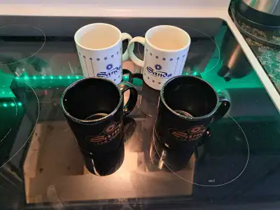 These collectible Sands Casino mugs, including both white and black styles, are a great find for any...