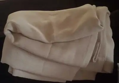 Pair of beige curtains. 2 separate curtains. Full length. If genuinely interested, I will provide ex...