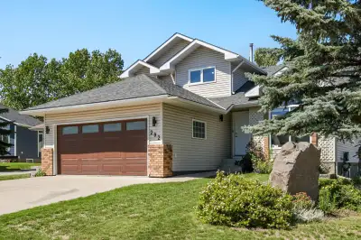 **Welcome to 202 Hawktree Bay NW**, an updated home tucked into a peaceful cul-de-sac in the highly...