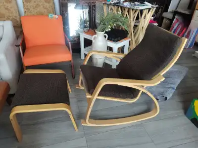 This stylish IKEA Poang chair, complete with a comfortable ottoman, is ready to bring relaxation to...