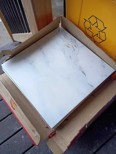 I got three boxes of porcelain tiles probably enough to do a small bathroom come and get them