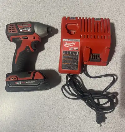 Milwaukee Impact and Charger and Battery, View more