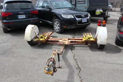 It has new bearings, new tie down straps, and new magnetic lights. It has 2 cracks in the fenders, a...