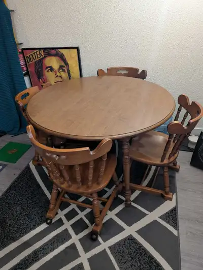 Antique Wood Dining Table and 4 Rolling Chairs and 2 leaves, View more