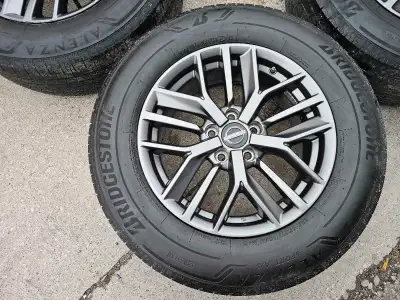 Set of 4 original 17" Nissan rogue rims with BRIDGESTONE summer tires on them 235/65/R17. Rims and t...