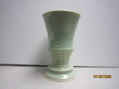 Hand Made pottery vase by well known Canadian Artist (signed on the bottom). Vase stands 6 1/2 inche...