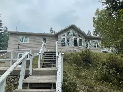 Beautiful lake front home for sale at Child’s Lake, Manitoba, in Duck Mountain Provincial Park. Thir...