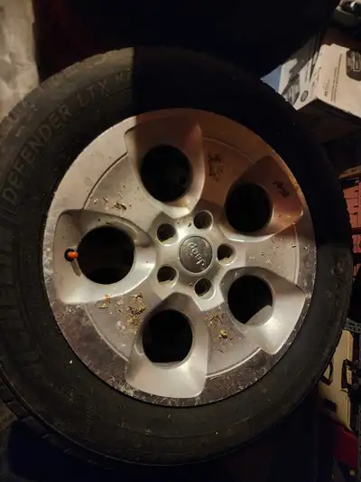 Set of 4 winters w Jeep Rims. First come first serve. Price negotiable. 40 percent tread.