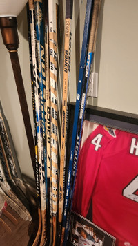 Various signed hockey sticks